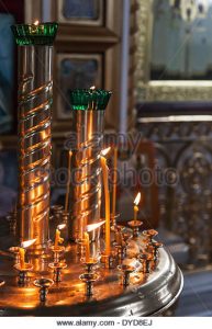 candles-are-lit-in-a-dark-orthodox-church-dyd8ej